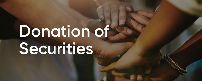 Image of many hands on top of each other with the title Donation of Securities