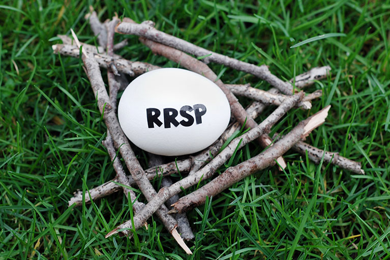 nest of twigs with an egg in the middle stamped with RRSP