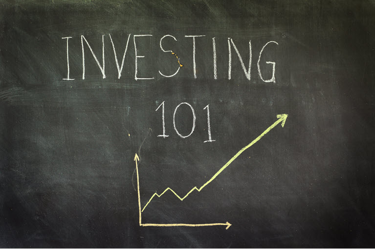 blackboard with Investing 101 on it with a positive graph