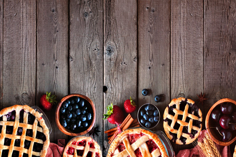 an assortment of fruit and fruit pies