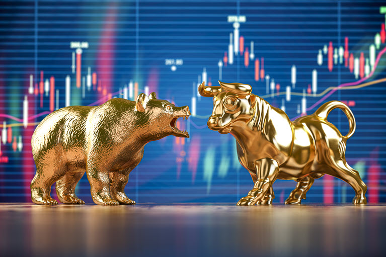 golden figurines of bull and bear facing off