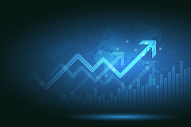 dark background showing a line representing stock market that goes up and down but ends going up