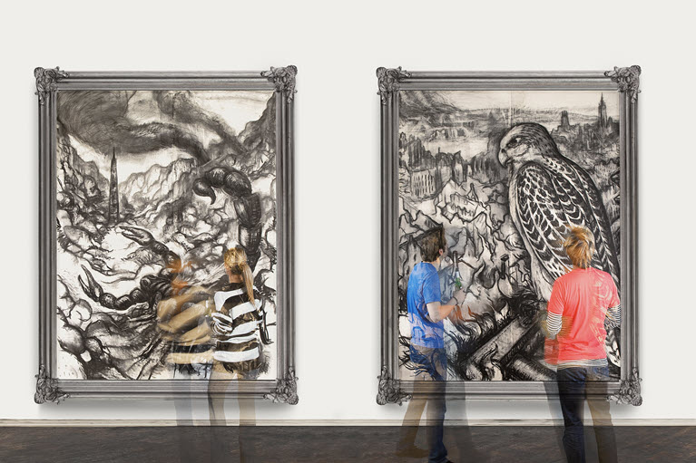 2 people looking at large pieces of art on the wall
