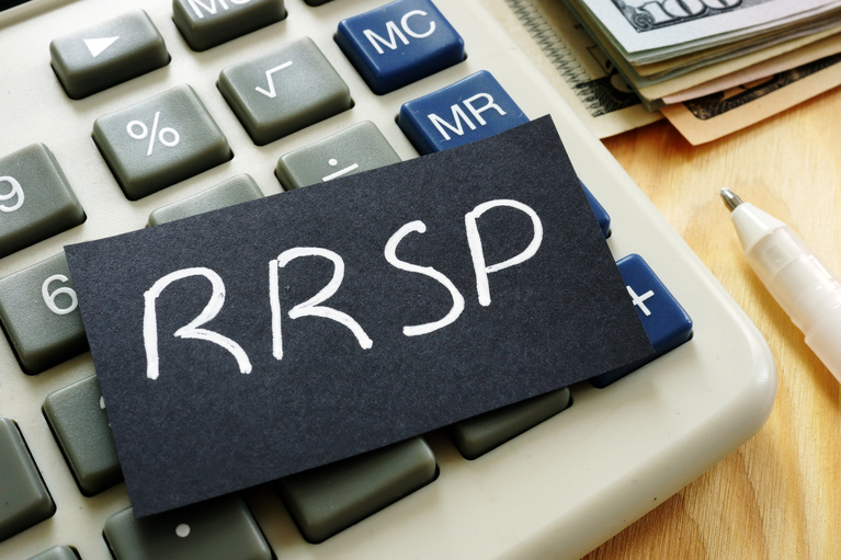 calculator with a slip of paper marked RRSP on it