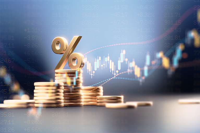 Graphic image of currency and a graph signifying investment growth.  