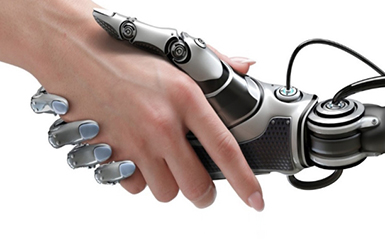 A robotic hand shakes a human hand.