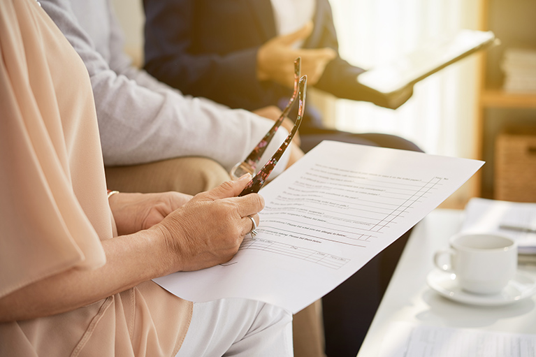 People reading a document