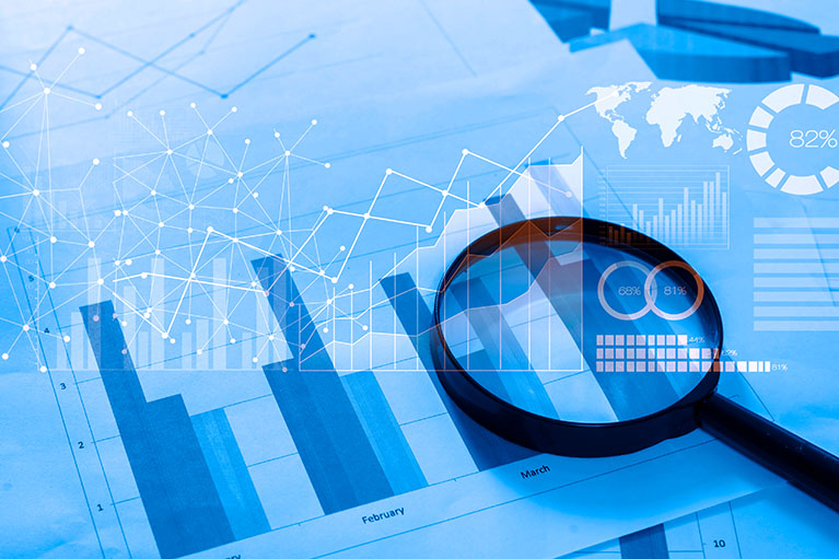 Magnifying glass over bar chart