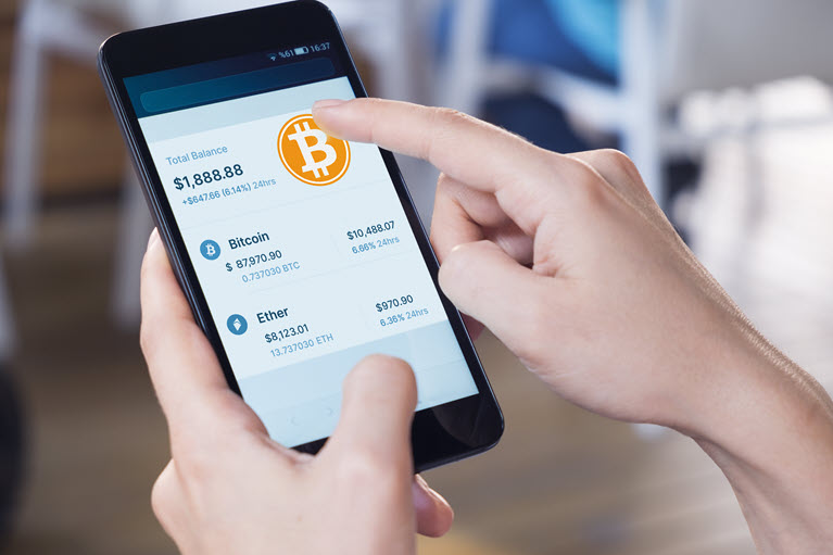 A person holding a phone where we can see their owning share of bitcoin