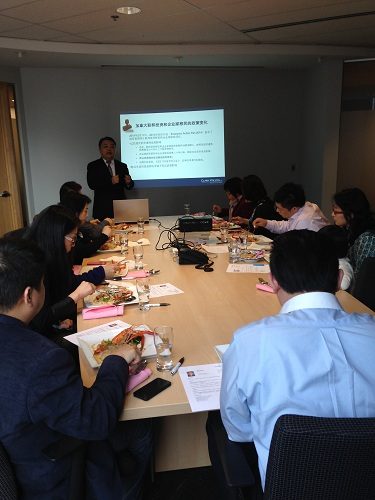 A man talking during a seminar.