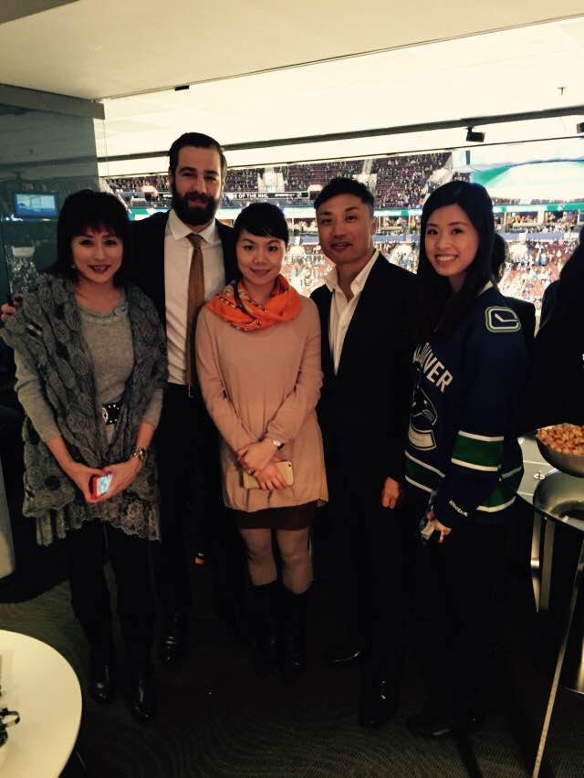 The Johnny Cheung Wealth Management Group with some vip client in a suit at the roger's arena.