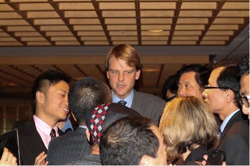 People during a presentation at the Pan Pacific Hotel.
