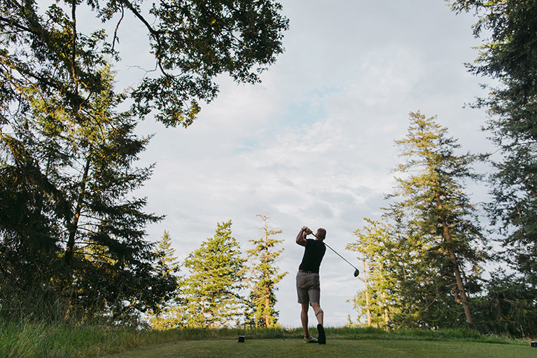 A person playing golf.