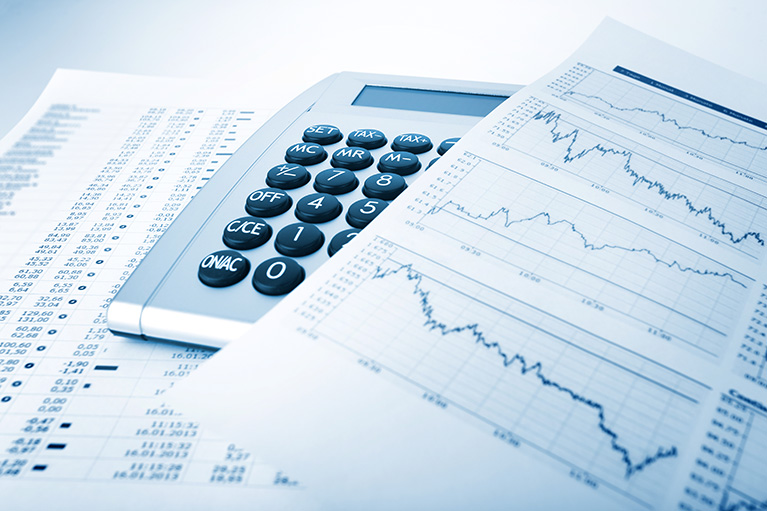 image of a calculator next to financial results demonstrating market summary.
