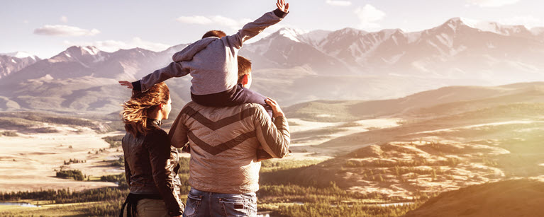 A family looking at mountains thinking about their TFSA, FHSA, RRSP.