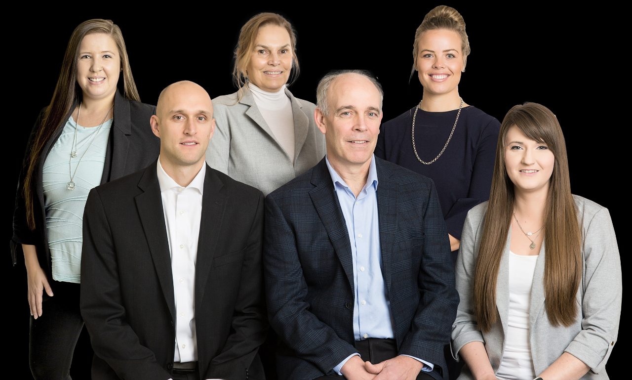 MacDougall Wealth Management Group. Back row left to right Dianne, Samantha, Kellsey, front row left to right Christopher, Iain, Shaylene.