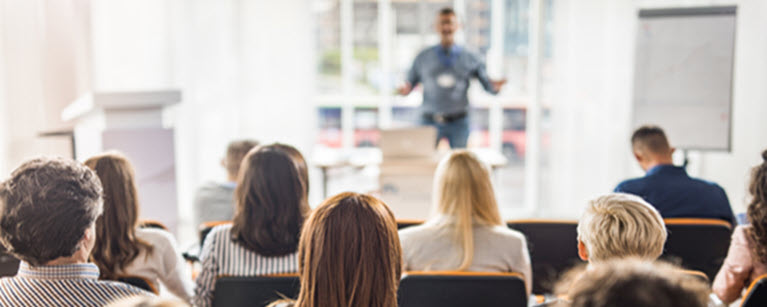 A man giving a presentation to a group of people.