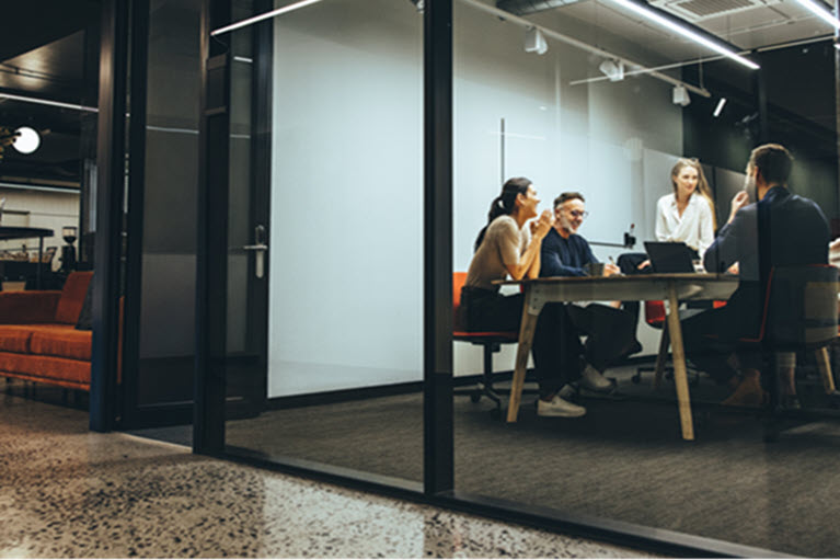 A team in an office, brainstorming investments  for family businesses and entrepreneurs.
