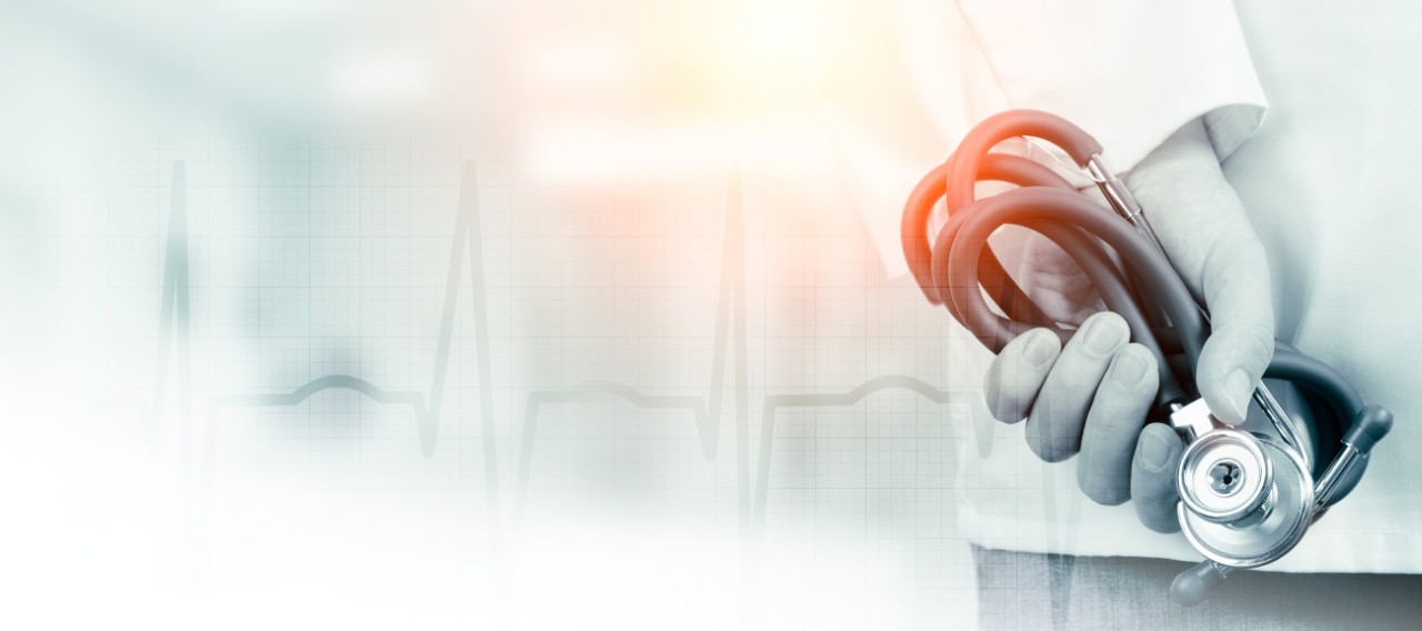 Doctor with stethoscope in a hospital. Web banner background template