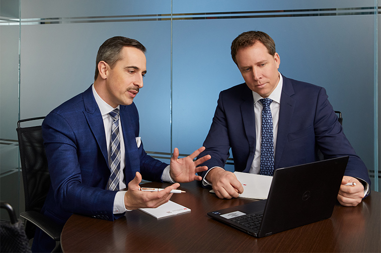 Meridiem Financial Group's wealth management advisors analyzing and discussing your financial management.
