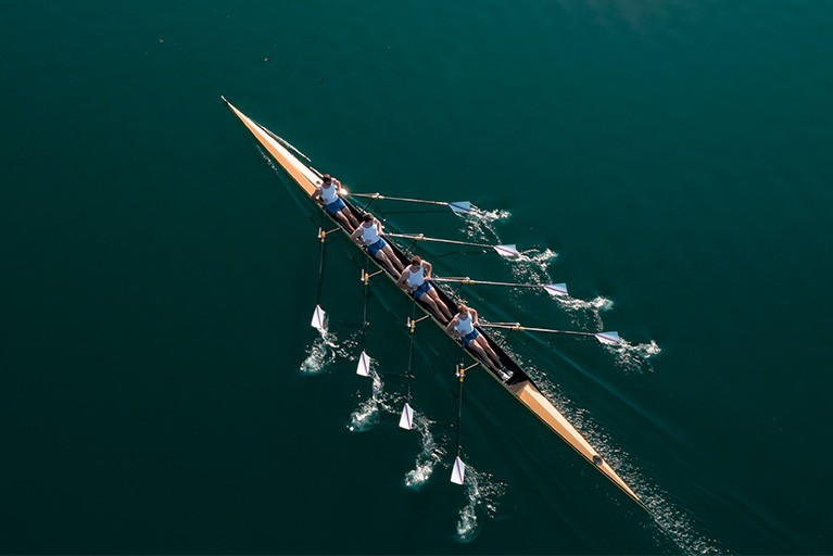 Team rowing a boat