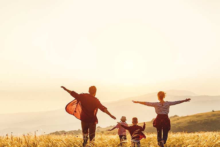 Happy family in a field.