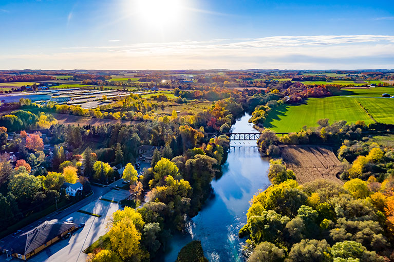 Aerial view of a river and a bridge.