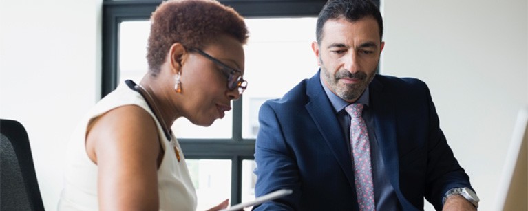 Professional woman and man in business meeting