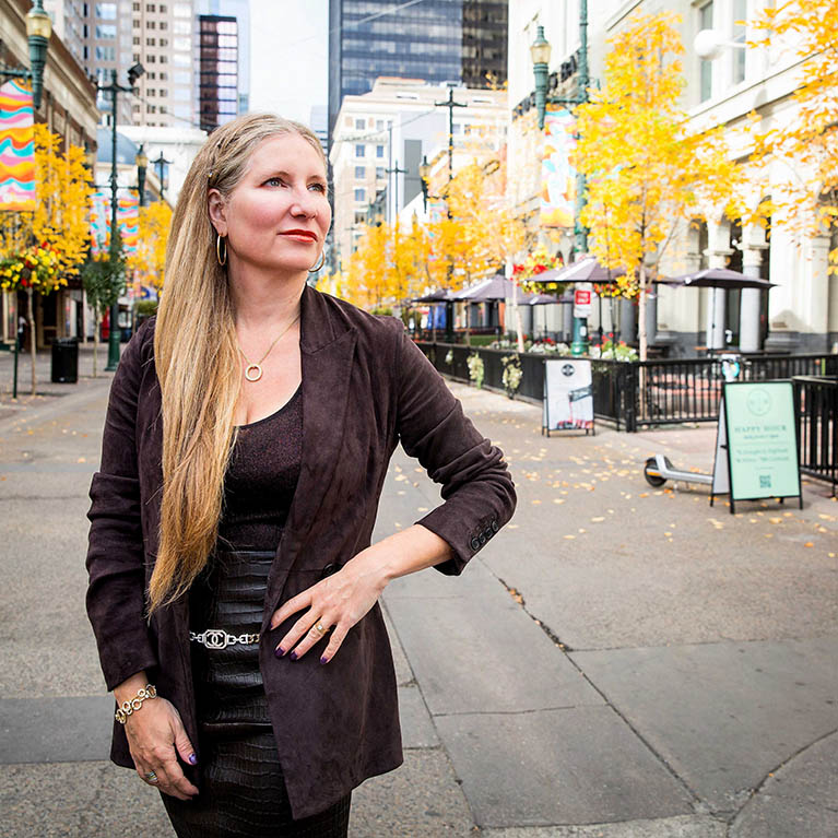  image of jennifer tozser posing on the street. 