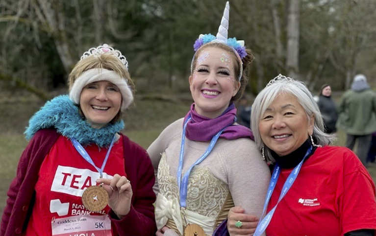 Viola on the left, Racheal in the middle and Annette on the right posing at the Goddess Run