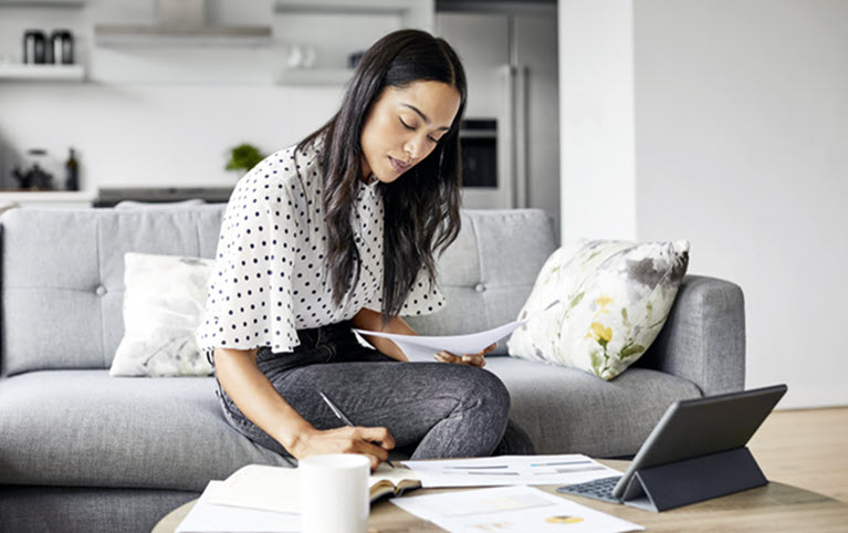 A woman reviewing her budget after the givernment released the federal budget.