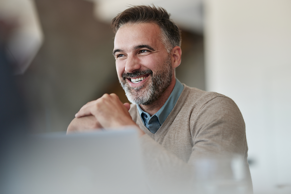 Photo of a National Bank Financial – Wealth Management advisor who is happy that they switched to a unique workplace